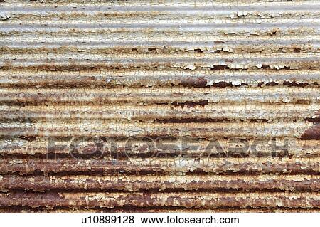 Stock Photo - Peeling paint on rusting surface.. Fotosearch