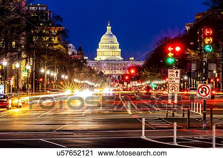 Stock Image - Pennsylvania Ave to US Capitol with streaked lights going towards US Capitol in Washington DC. during rush hour PM. Fotosearch