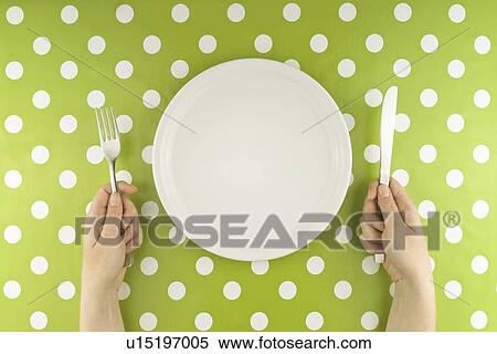 Stock Photography - Person with empty plate.. Fotosearch