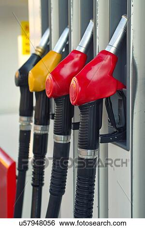 Petrol pump nozzles. View Large Photo Image Stock Photograph - Petrol pump nozzles.. Fotosearch