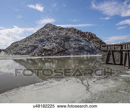 Stock Photography - Piles of scrap metal at Bootle Docks, Merseyside, UK, awaiting export.. Fotosearch