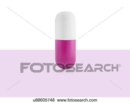 Stock Photo - Pink and white capsule, studio shot.. Fotosearch