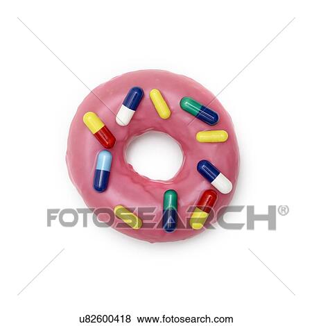 Pink doughnut with capsules, studio shot. View Large Photo Image Stock Photo - Pink doughnut with capsules, studio shot.. Fotosearch