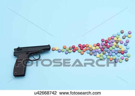Pistol shooting sweets. View Large Photo Image Stock Image - Pistol shooting sweets.. Fotosearch