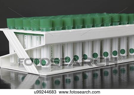Stock Image - Plastic test tubes in rack.. Fotosearch
