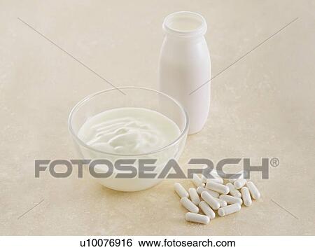 Probiotic pills and yoghurt, still life. View Large Photo Image Stock Photograph - Probiotic pills and yoghurt, still life.. Fotosearch
