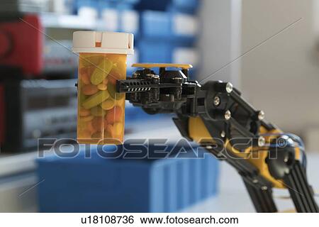 Stock Photograph - Robotic arm holding bottle of pills.. Fotosearch