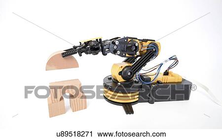 Stock Image - Robotic arm using building blocks.. Fotosearch