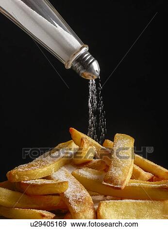 Salt pouring onto chips. View Large Photo Image Stock Photo - Salt pouring onto chips.. Fotosearch