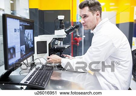 Scientist checking a nanofibre structure under a light microscope. View Large Photo Image Stock Image - Scientist checking a nanofibre structure under a light microscope.. Fotosearch