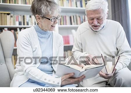 Senior couple reading books. View Large Photo Image Stock Photo - Senior couple reading books.. Fotosearch