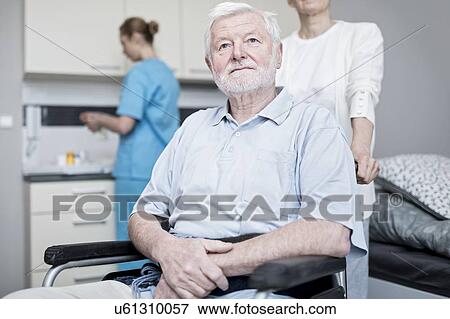 Stock Photo - Senior man in wheelchair in care home.. Fotosearch