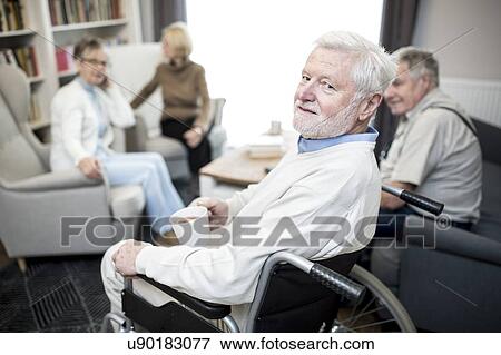 Senior man in wheelchair in care home. View Large Photo Image Stock Photo - Senior man in wheelchair in care home.. Fotosearch
