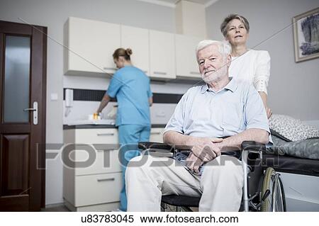 Senior man in wheelchair with woman in care home. View Large Photo Image Stock Photography - Senior man in wheelchair with woman in care home.. Fotosearch