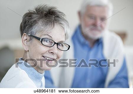 Senior woman in glasses smiling towards camera, portrait. View Large Photo Image Stock Image - Senior woman in glasses smiling towards camera, portrait.. Fotosearch