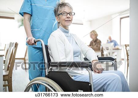 Senior woman in wheelchair in care home. View Large Photo Image Stock Image - Senior woman in wheelchair in care home.. Fotosearch