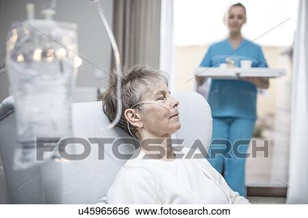 Senior woman with nasal cannula and IV bag. View Large Photo Image Stock Photograph - Senior woman with nasal cannula and IV bag.. Fotosearch