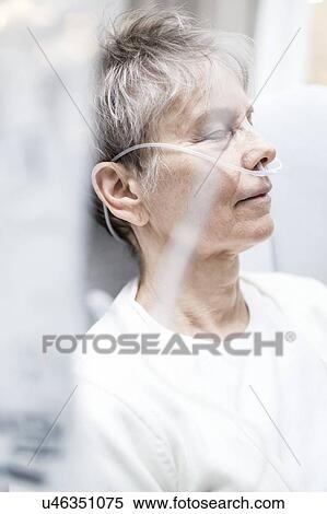 Stock Photography - Senior woman with nasal cannula.. Fotosearch