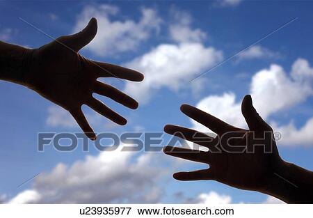 Silhouette of two hands reaching towards each other. View Large Photo Image Stock Photo - Silhouette of two hands reaching towards each other.. Fotosearch