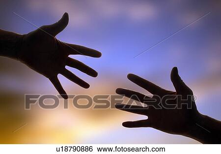 Silhouette of two hands reaching towards each other. View Large Photo Image Stock Photograph - Silhouette of two hands reaching towards each other.. Fotosearch