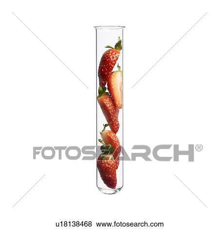 Stock Photo - Sliced strawberries in test tube, studio shot.. Fotosearch