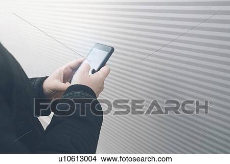 Smartphone use. View Large Photo Image Picture - Smartphone use.. Fotosearch