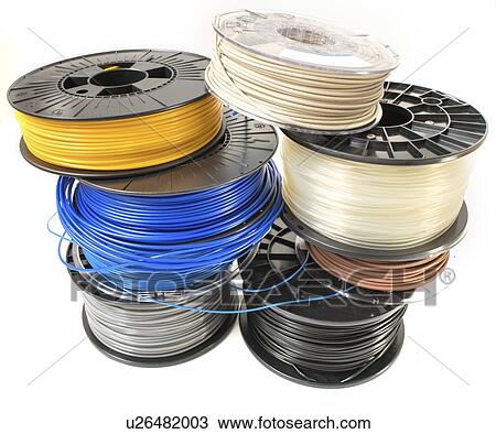 Stock Image - Spools of plastic filaments for 3D printing.. Fotosearch