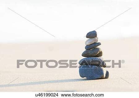 Stacked stones on a beach. View Large Photo Image Picture - Stacked stones on a beach.. Fotosearch