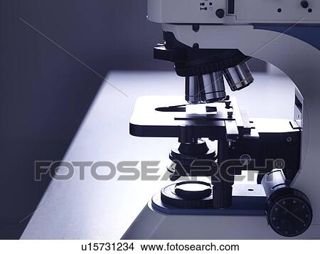 Still life of a microscope on a laboratory bench to illustrate research. View Large Photo Image Picture - Still life of a microscope on a laboratory bench to illustrate research.. Fotosearch