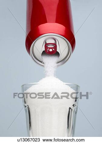 Sugar pouring from a drinks can into a glass. View Large Photo Image Stock Image - Sugar pouring from a drinks can into a glass.. Fotosearch