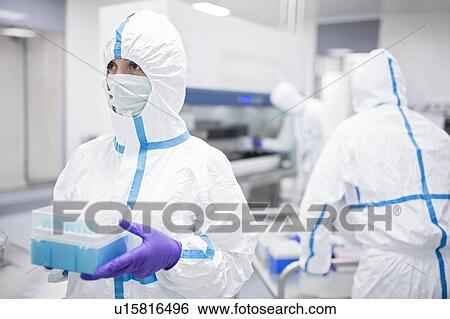 Technician holding cell samples in in a laboratory that engineers human tissues for implant. Such implants include bone and skin grafts. View Large Photo Image Stock Photograph - Technician holding cell samples in in a laboratory that engineers human tissues for implant. Such implants include bone and skin grafts.. Fotosearch