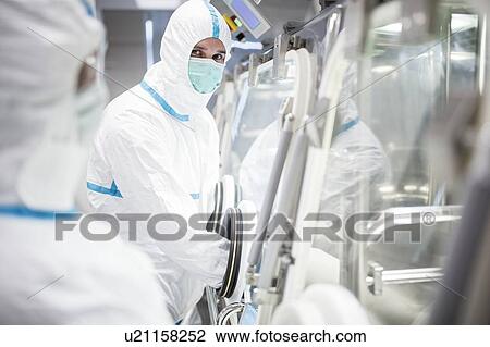 Technicians working in sealed, sterile isolator units in a laboratory that manufactures human tissues for implant. Such tissues include bone and skin grafts. View Large Photo Image Stock Image - Technicians working in sealed, sterile isolator units in a laboratory that manufactures human tissues for implant. Such tissues include bone and skin grafts.. Fotosearch