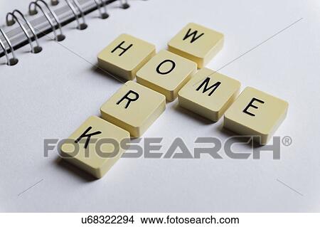 Picture - Tiles with letters spelling the words home and work.. Fotosearch