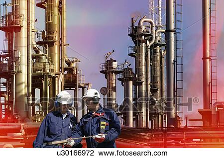 Two oil and gas engineers in front of a oil and fuel refinery. View Large Photo Image Stock Image - Two oil and gas engineers in front of a oil and fuel refinery.. Fotosearch