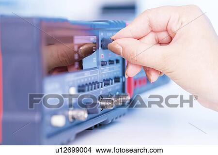 Picture - Using electronic test equipment.. Fotosearch