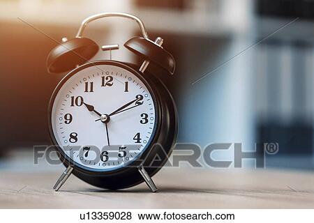 Vintage alarm clock on office table. View Large Photo Image Stock Photo - Vintage alarm clock on office table.. Fotosearch