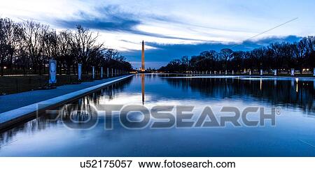 Stock Photo - Washington Monument and reflecting pond at sunrise, Washington D. C.. Fotosearch