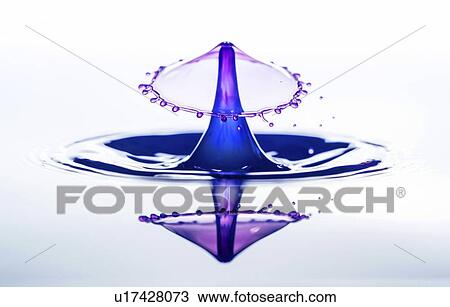 Stock Image - Water splash with a crown and reflection.. Fotosearch