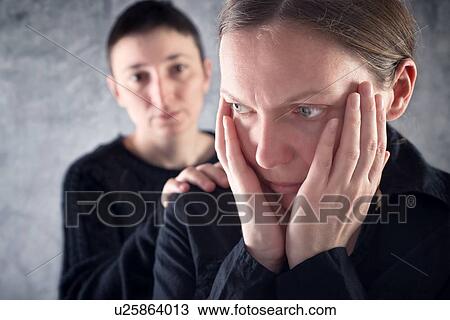 Stock Image - Woman consoling upset friend.. Fotosearch
