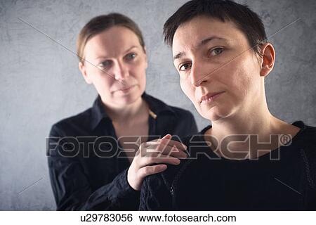 Woman consoling upset friend. View Large Photo Image Stock Photograph - Woman consoling upset friend.. Fotosearch