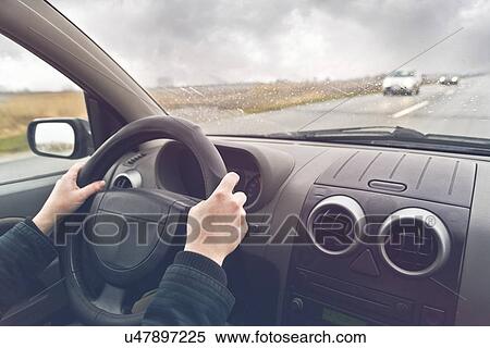 Stock Photography - Woman driving a car, conceptual image.. Fotosearch