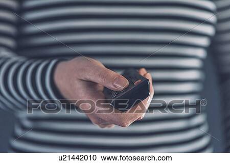 Woman using remote control. View Large Photo Image Stock Image - Woman using remote control.. Fotosearch