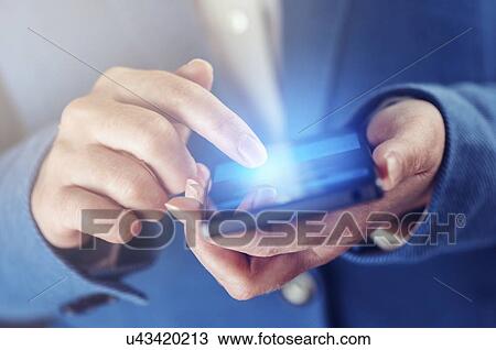Stock Image - Woman using smartphone.. Fotosearch