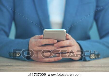 Stock Photo - Woman using smartphone.. Fotosearch