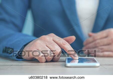 Stock Photo - Woman using smartphone.. Fotosearch