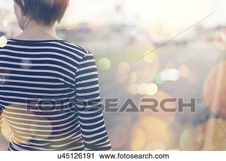 Woman walking along street. View Large Photo Image Stock Image - Woman walking along street.. Fotosearch