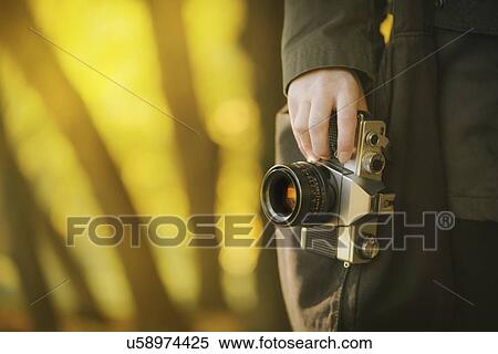 Stock Photography - Woman with vintage camera.. Fotosearch