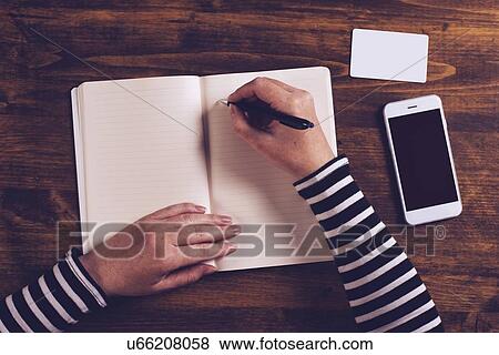 Woman writing in notebook. View Large Photo Image Stock Photo - Woman writing in notebook.. Fotosearch