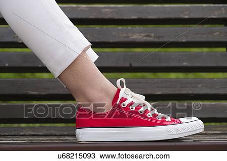Woman's foot on park bench. View Large Photo Image Stock Image - Woman's foot on park bench.. Fotosearch