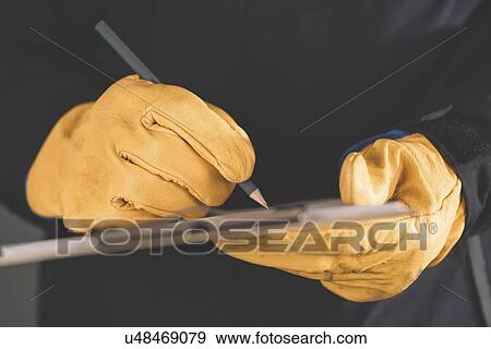 Workman writing notes. View Large Photo Image Stock Photo - Workman writing notes.. Fotosearch